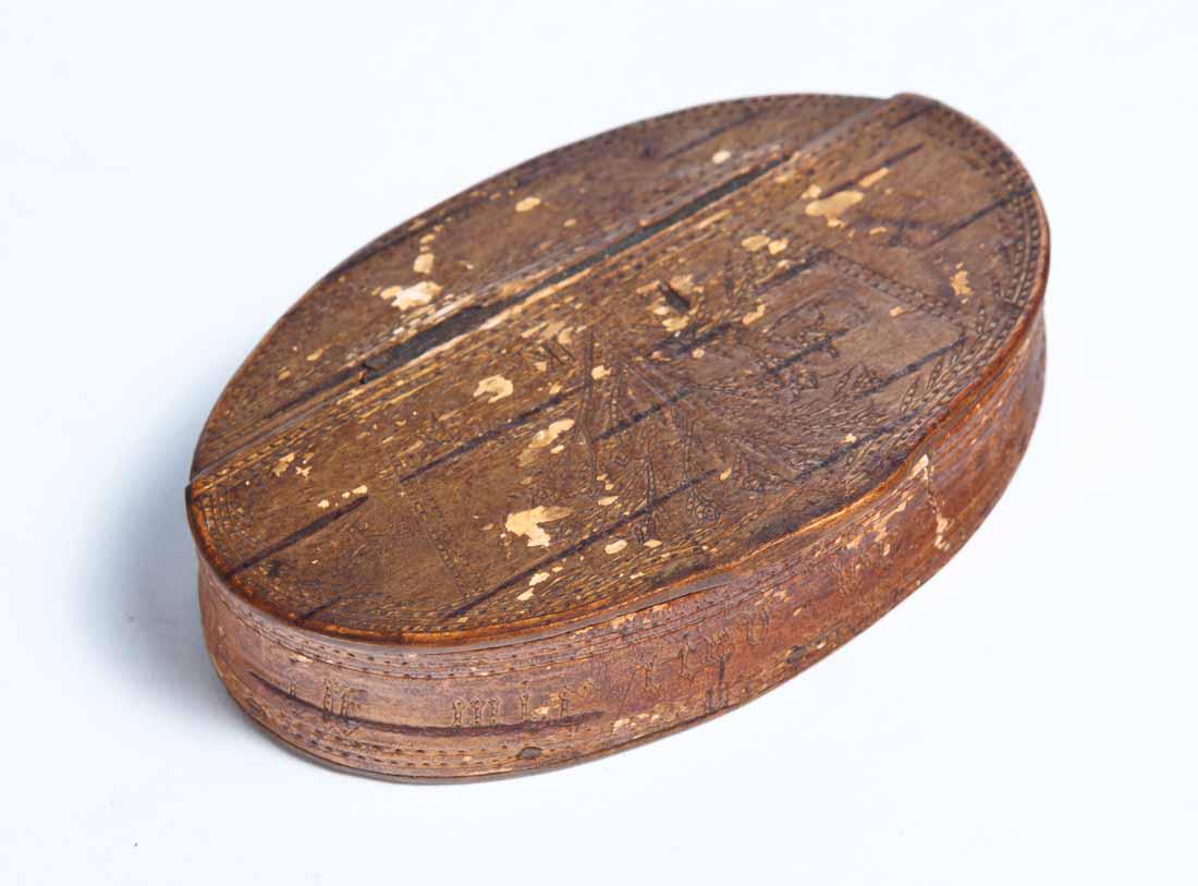 BIRCH BARK SNUFF BOX: Oval with hinged lid and German inscriptions around outside. .75"h. 2.5"w. 4"l.