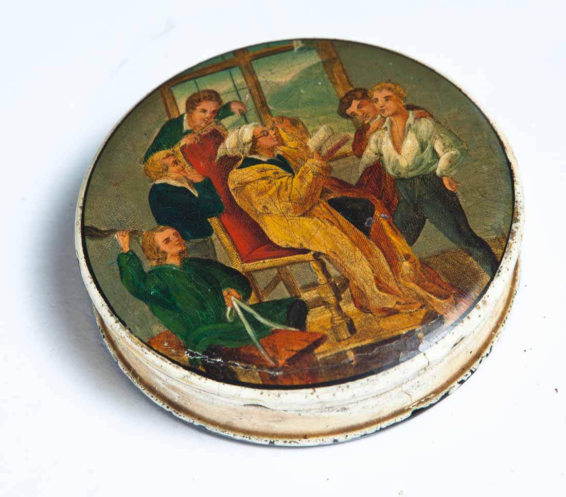 PAINT-DECORATED LACQUERWARE SNUFF BOX: Round with white painted exterior and lid decorated with interior scene of young men and tutor. Purchased from Garth's Auctions, Delaware, Ohio, 1/6/89. .75"h. 3" dia.