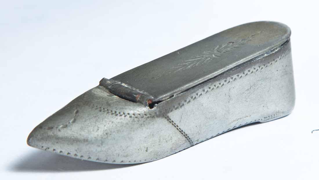 PEWTER SHOE SNUFF BOX: Ladies slipper with hinged lid and stitching accents. 1"h. 3.5"w. 1"d.