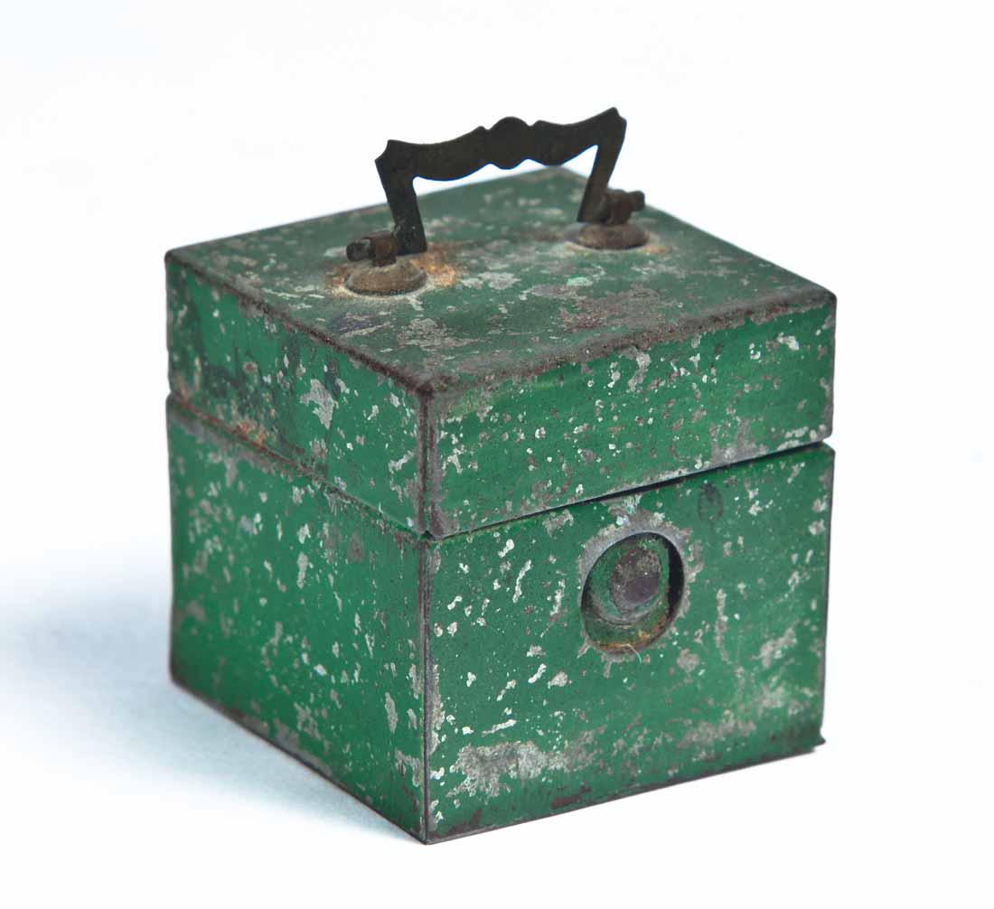 TRAVELING INK WELL: In a metal case with original green paint and a shaped metal bale handle. 1 .25" square.