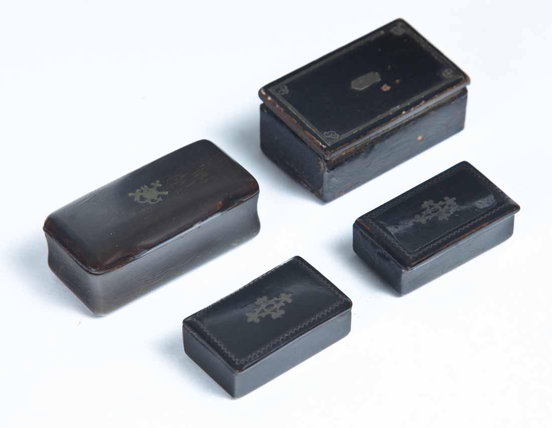 FOUR MINIATURE SNUFF BOXES: One horn with pewter inlay on lid. .75"h. 1 .75"w. 7/8"d. Three lacquerware, all with inlaid lids. 1.25"w - 1.75"w.