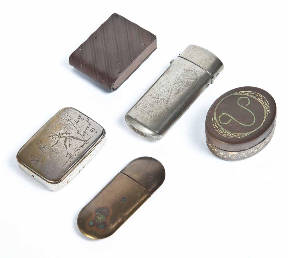 FIVE SMALL JARS OR BOXES: Four match safes; one brass, two silver plate with etched decoration, one early thermoplastic. 1.75"w - 2.75"w. Small oval brass pill box or jar with etched decoration. 1 .75"w.
