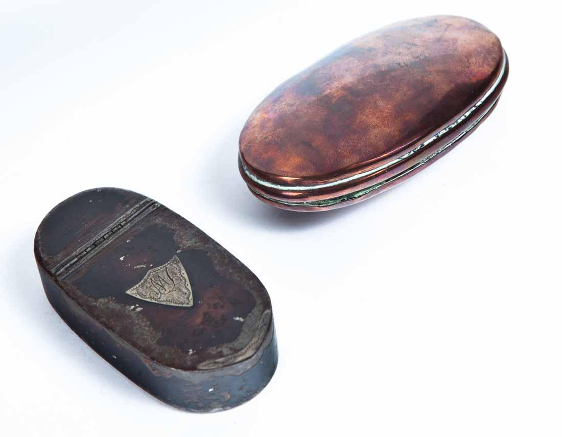 TWO SNUFF BOXES: Early oval copper with tin lining. 3 .5"w. Tin oval box with traces of original paint and inset silver shield monogramm plate. 3"w.