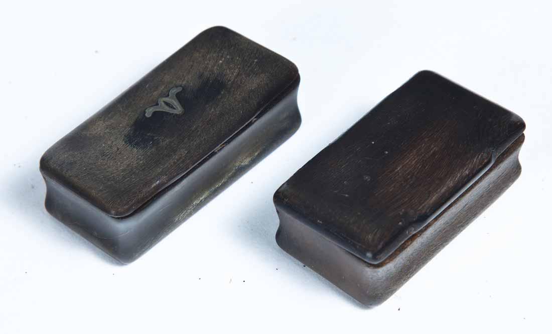 TWO SMALL CARVED HORN SNUFF BOXES: Both rectangular with hinged lids. One with small inlay in center. 2"w. 2.5"w.
