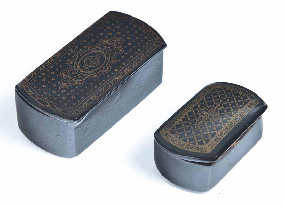TWO BLACK LACQUERWARE SNUFF BOXES: Both rectangular with rounded ends and gold decoration on lids. 2"l. 3"l.