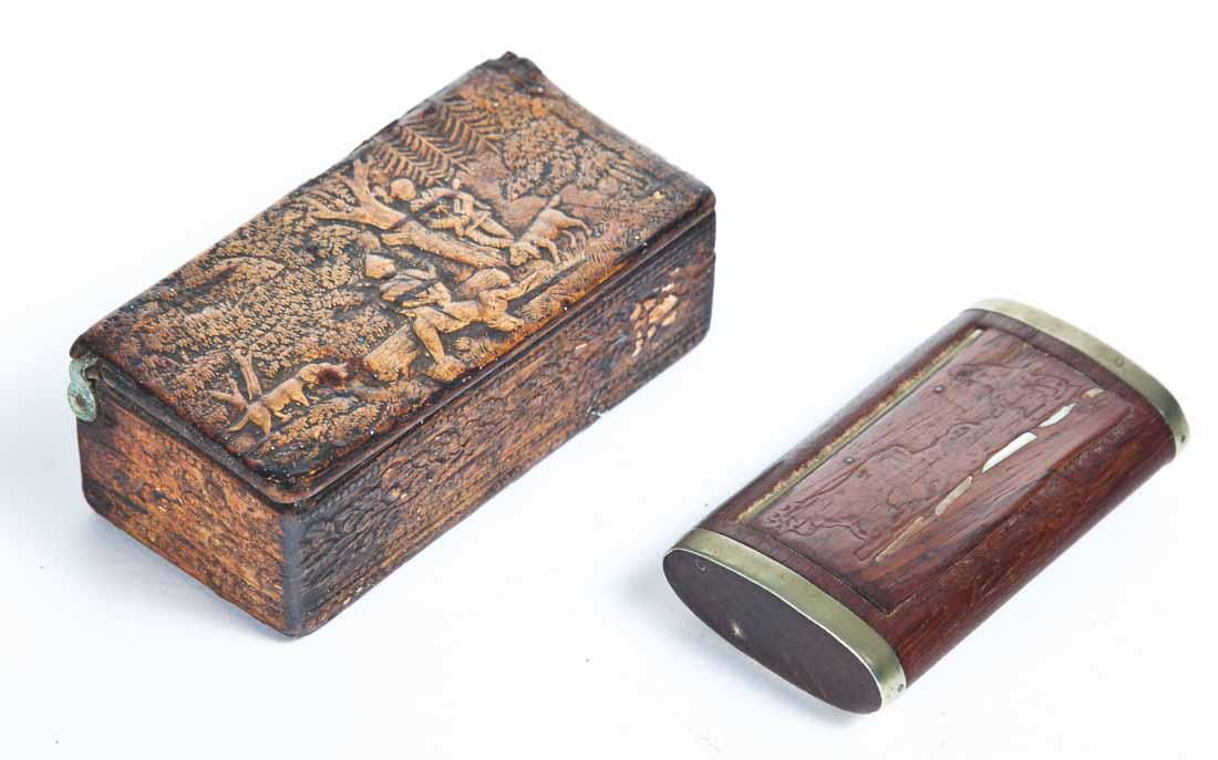 TWO WOOD SNUFF BOXES: One with embossed leather over wood with hunting scene on lid and floral decoration around sides. 3 .75"w. One inset lid with engraved scene of farmer behind an ox pulling a plow. 3"w.