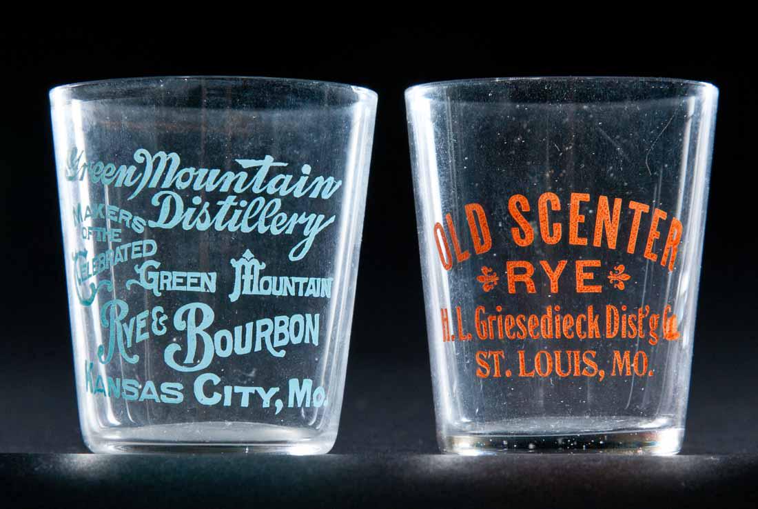 2 PRE-PROHIBITION MISSOURI SHOT GLASSES: Old Scented Rye, H.L. Griesediech Dist., St. Louis and Green Mountain Distillery, Kansas City; both with unusual colored decoration. 2.25" high.