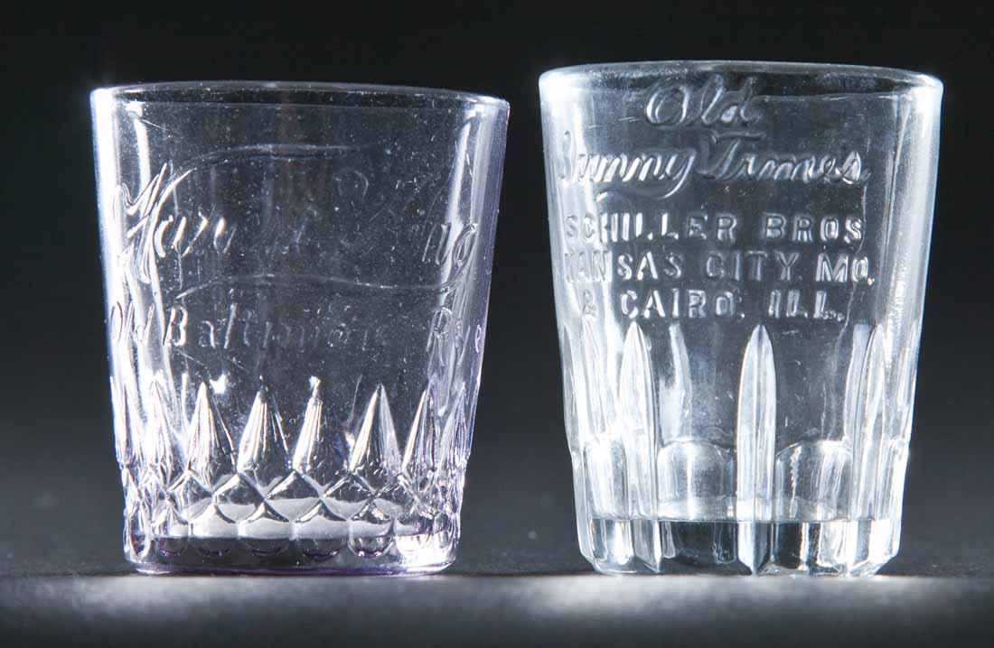 2 EMBOSSED PRE-PROHIBITION SHOT GLASSES: Old Sunny Times, Cairo, Illinois and Harvest King, Old Baltimore Rye. 2.5" and 2.25" high.
