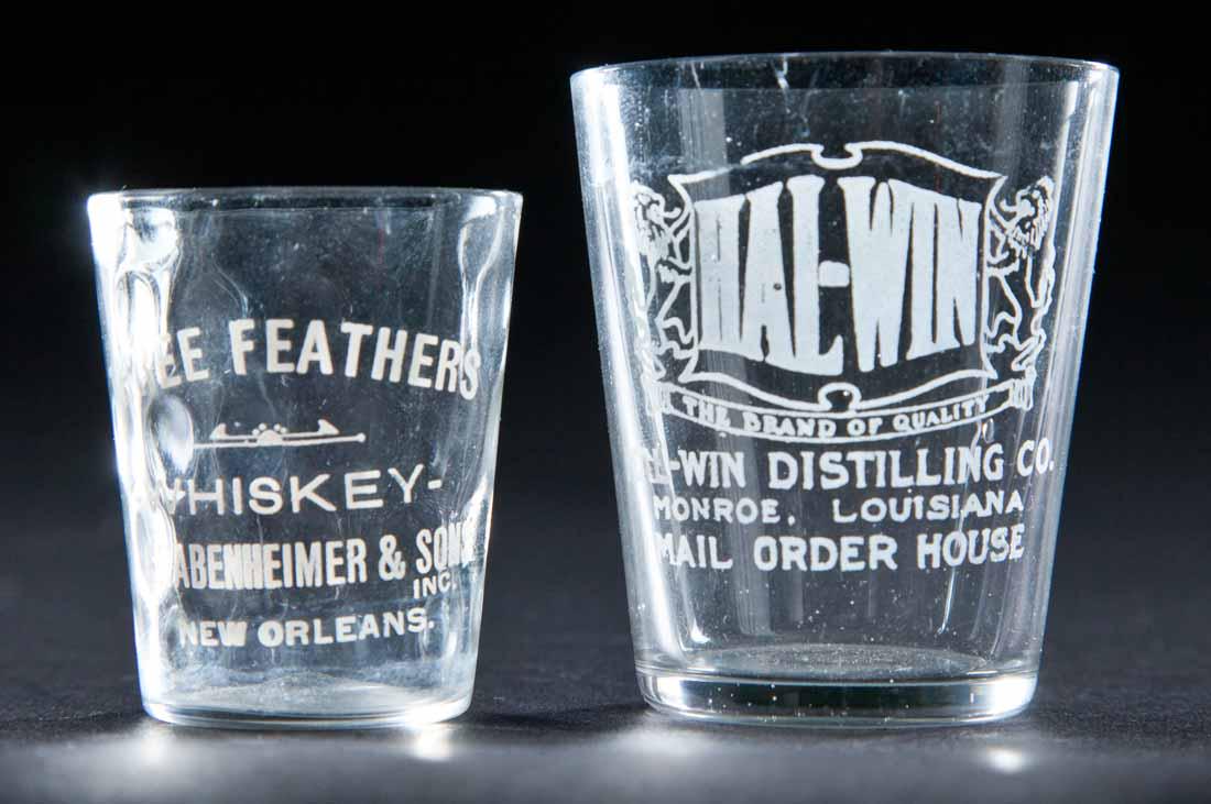 2 PRE-PROHIBITION LOUISIANA SHOT GLASSES: Hal-Win Distilling, Monroe and Three Feathers Whiskey, New Orleans. 2" and 2.25" high.