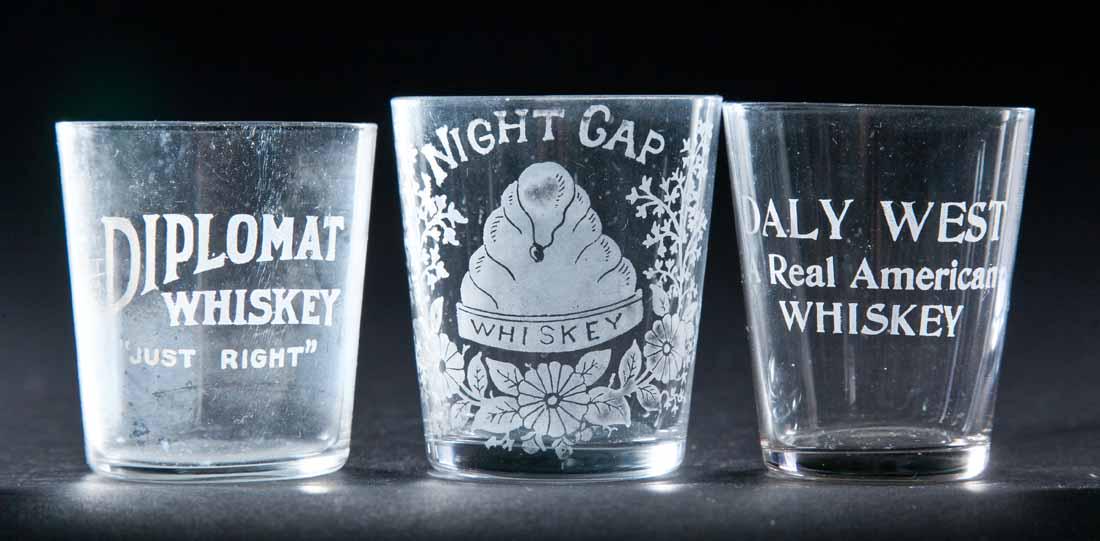 3 PRE-PROHIBITION SHOT GLASSES: Night Cap Whiskey, Diplomat Whiskey, and Daly West Whiskey. 2.25" high.