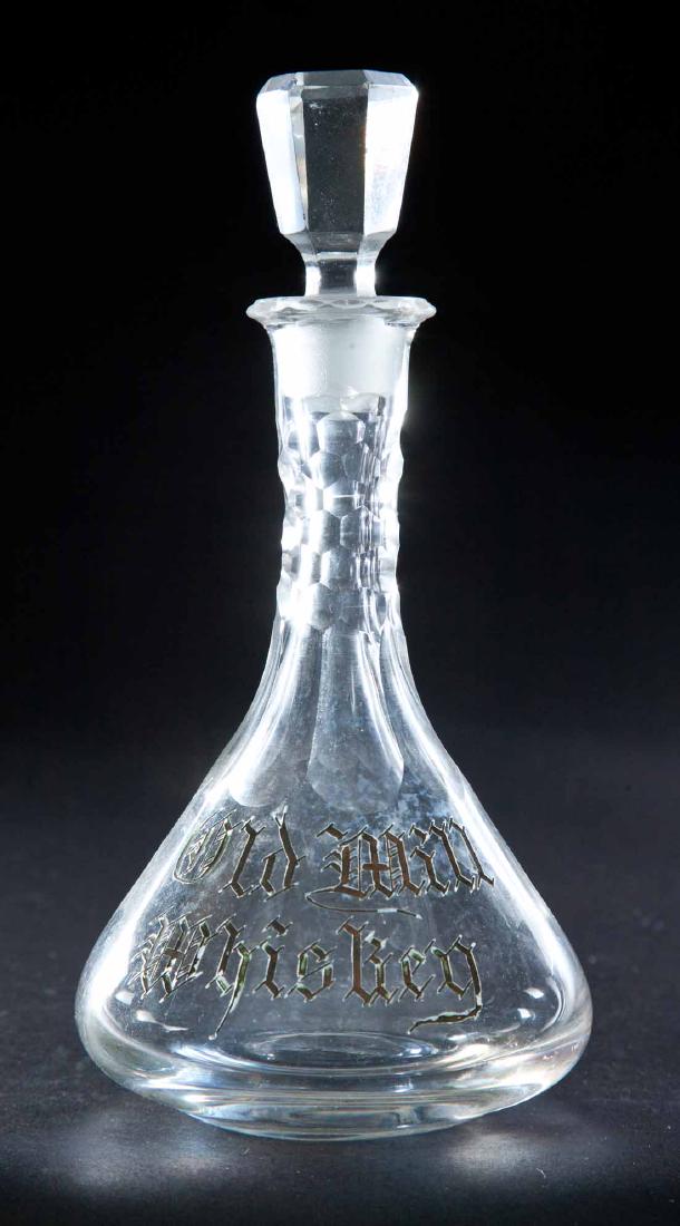 ENAMELED LABEL WHISKEY BOTTLE: Colorless pre-Prohibition decanter with paneled neck and flared body and label for "Old Mill Whiskey". Paneled stopper. 8.5"h.