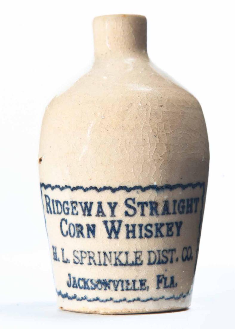 JACKSONVILLE, FLORIDA MINIATURE ADVERTISING JUG: Cream glaze and stamped advertisement "RIDGEWAY STRAIGHT CORN WHISKEY H.L. SPRINKLE DIST. CO." 3.25" high.