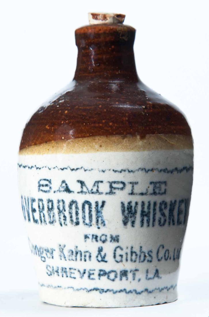 SHREVEPORT, LOUISIANA MINIATURE ADVERTISING JUG: Bicolor glaze and stamped advertisement "SAMPLE OVERBROOK WHISKEYâ€¦" 3.25" high.
