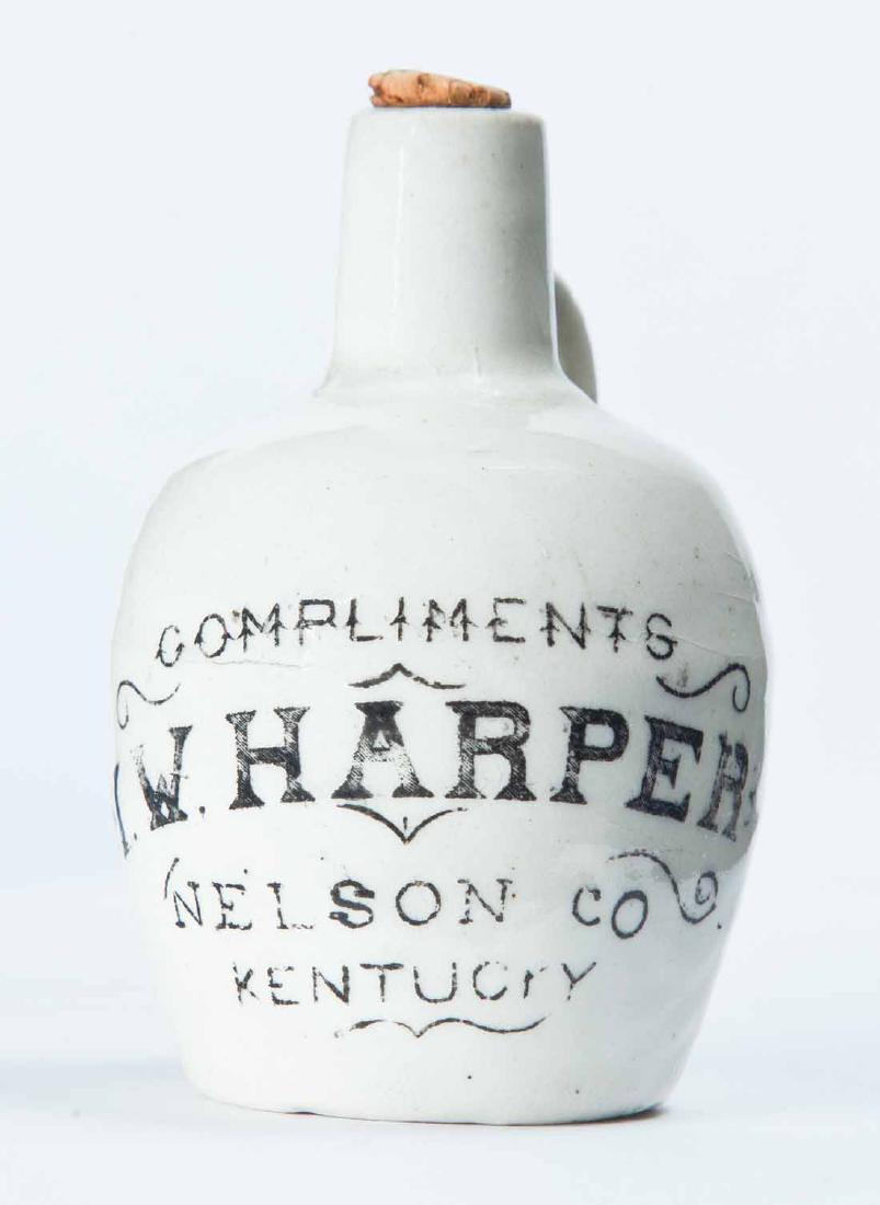 NELSON COUNTY, KENTUCKY MINIATURE ADVERTISING JUG: White glaze and stamped advertisement "COMPLIMENTS I.W. HARPER." 3.5" high.