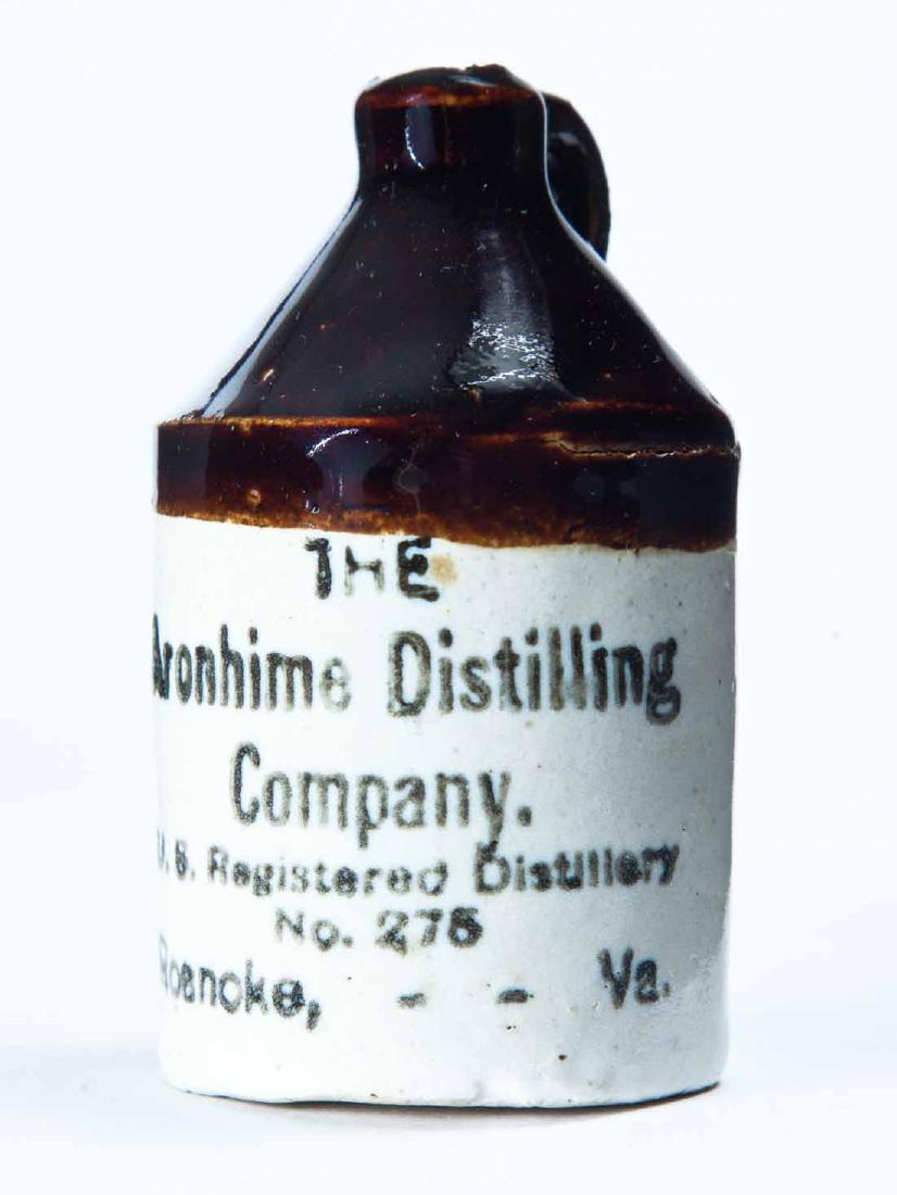 ROANOKE, VIRGINIA MINIATURE ADVERTISING JUG: Bicolor glaze and stamped advertisement "THE Aronhime Distilling Companyâ€¦" 3" high.
