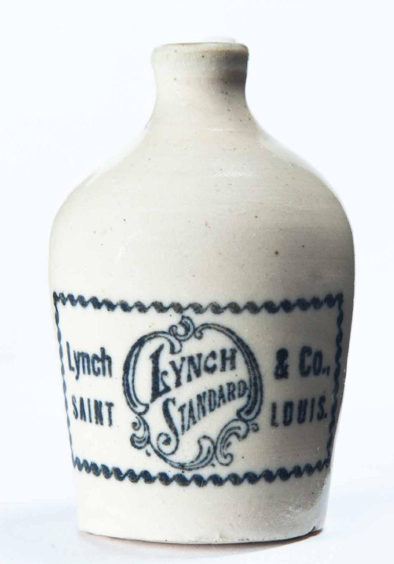 ST. LOUIS, MISSOURI MINIATURE ADVERTISING JUG: Cream glaze and stamped advertisement "Lynch & Co., SAINT LOUIS." 3.25" high.