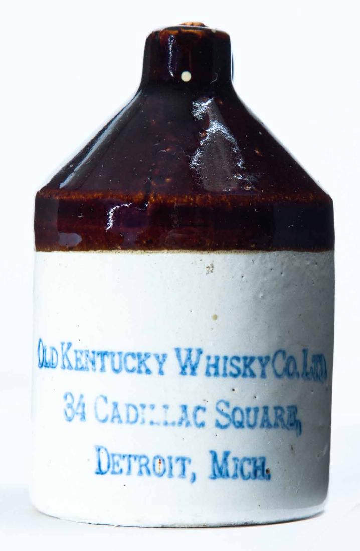 DETROIT, MICHIGAN MINIATURE ADVERTISING JUG: Bicolor glaze and stamped advertisement "OLD KENTUCKY WHISKEY CO. LTD., CADILLAC SQUAREâ€¦" 3.5" high.