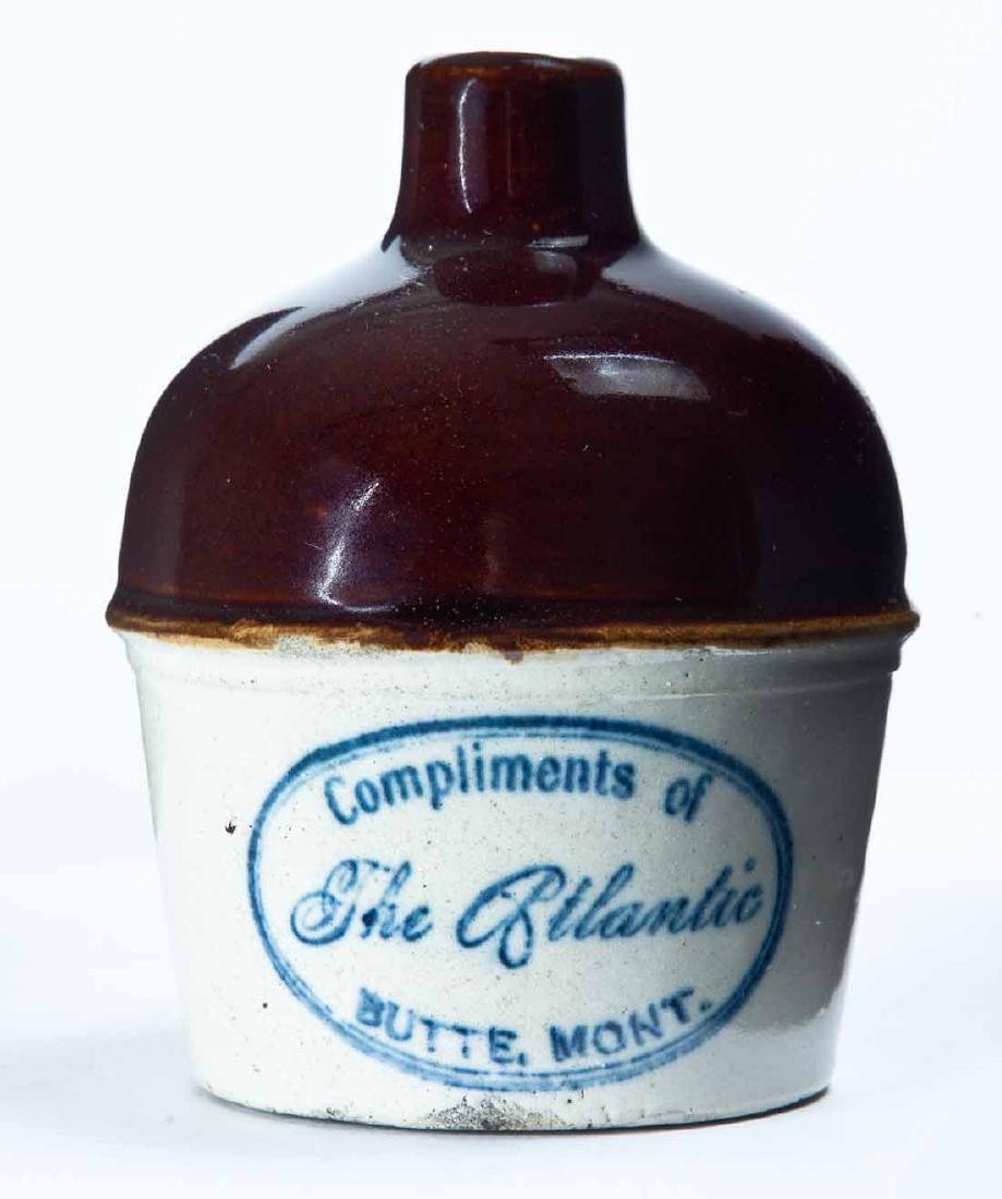 BUTTE, MONTANA MINIATURE ADVERTISING JUG: Bicolor glaze and stamped advertisement "Compliments of The Atlanticâ€¦" 4.25" high.