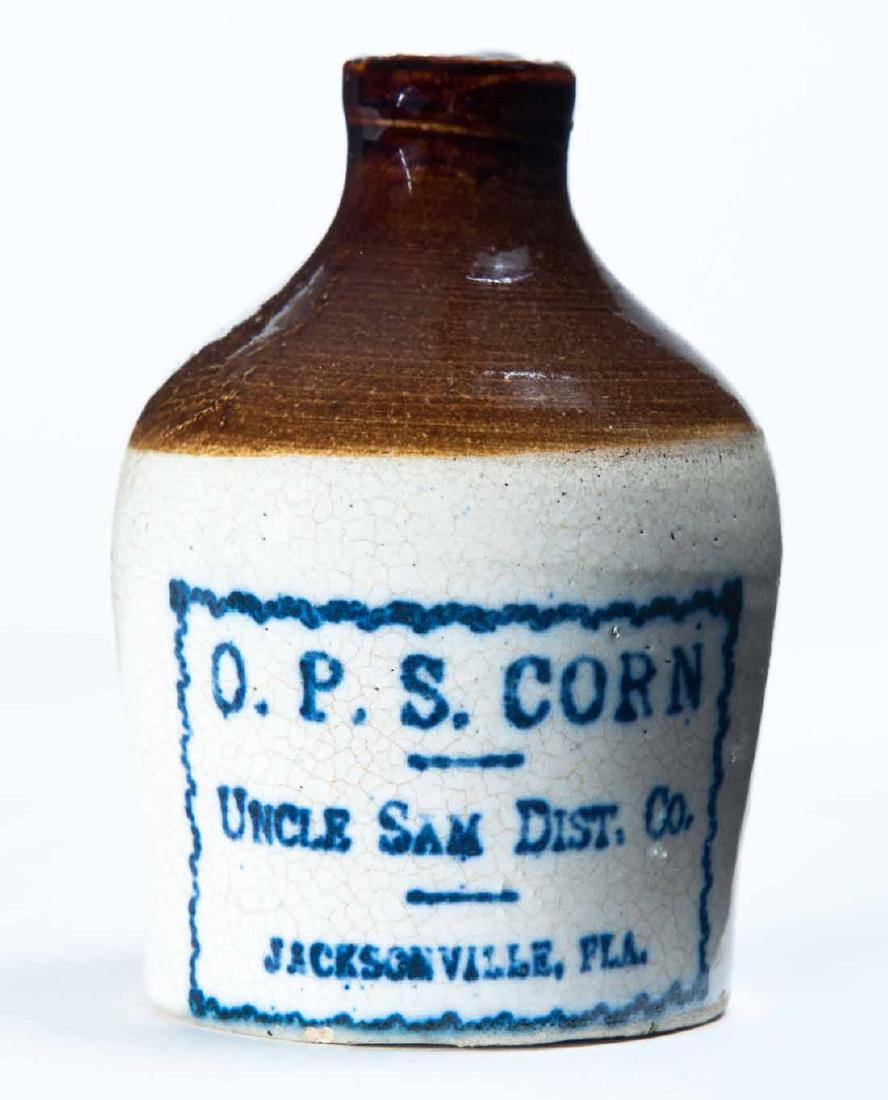 JACKSONVILLE, FLORIDA MINIATURE ADVERTISING JUG: Bicolor glaze and stamped advertisement "O.P.S. CORN UNCLE SAM DIST. CO." 3" high.