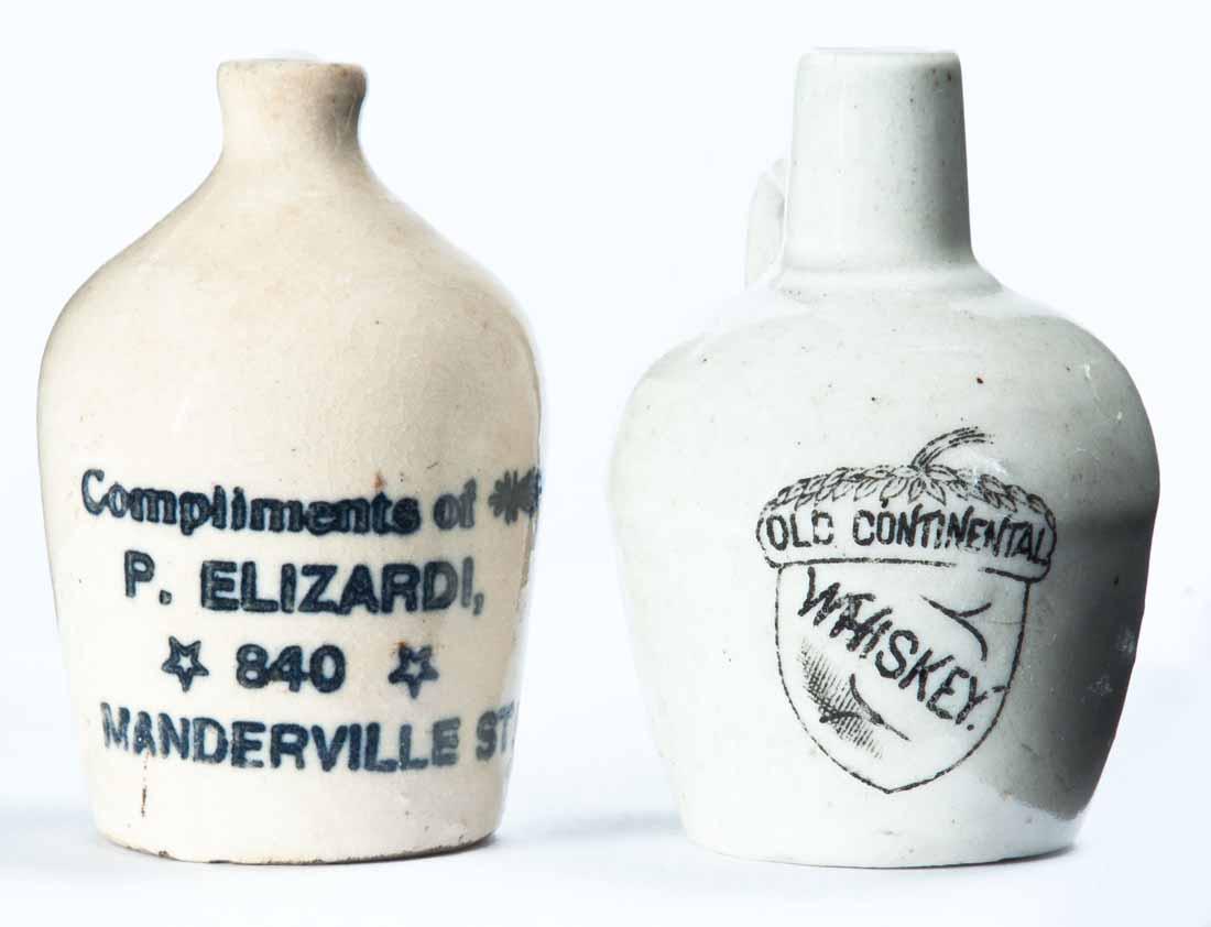 2 MINIATURE ADVERTISING JUGS: Cream glaze and printed advertisements "OLD CONTINENTAL WHISKEY" and "Compliments of P. ELIZARDI 840 MANDERVILLE ST." 3.25" high.