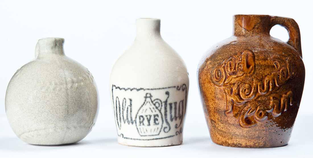 3 MINIATURE ADVERTISING JUGS: "Old Kernal Corn," "Old RYE Jug," and a baseball-form jug. 2.5", 3", and 3.25" high.