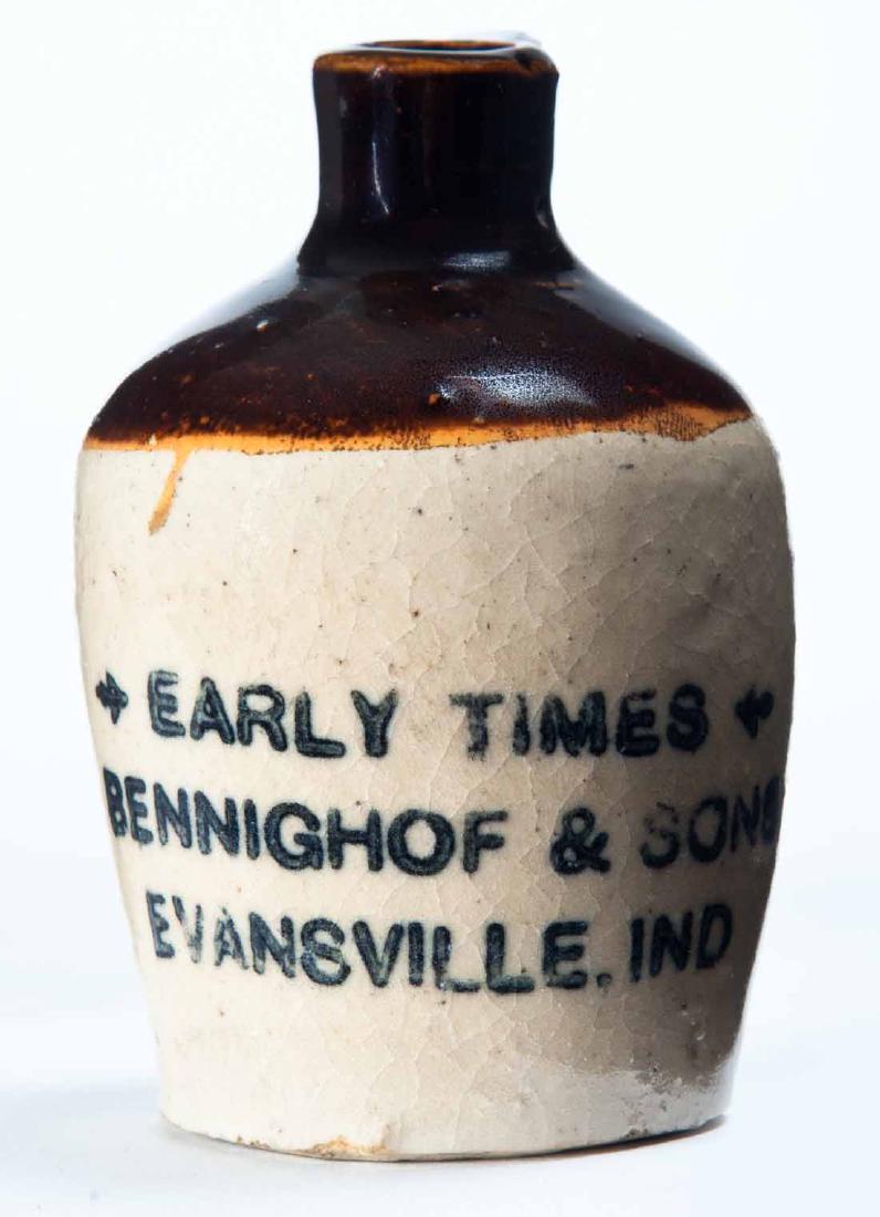 EVANSVILLE, INDIANA MINIATURE ADVDERTISING JUG: Bicolor glaze and stamped advertisement "EARLY TIMES BENNINGHOFF & SONSâ€¦" 3" high.