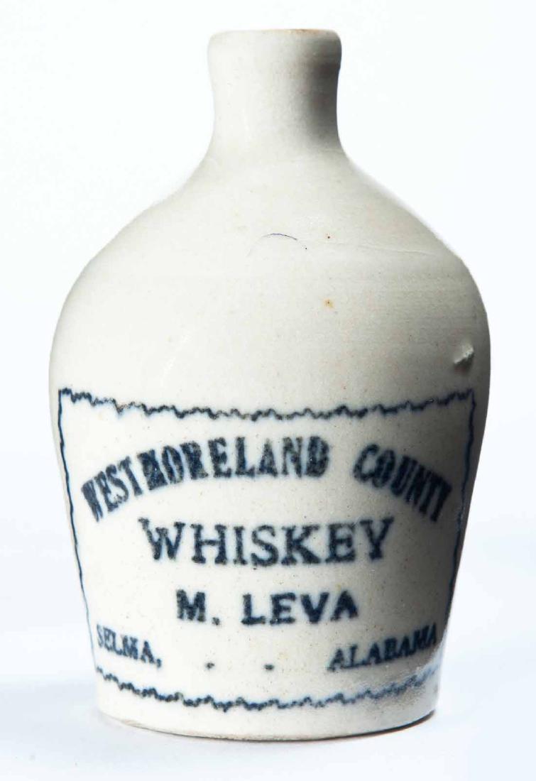 SELMA, ALABAMA MINIATURE ADVERTISING JUG: Cream glaze and stamped advertisement "WESTMORELAND COUNTY WHISKEY M. LEVAâ€¦" 3.25" high.