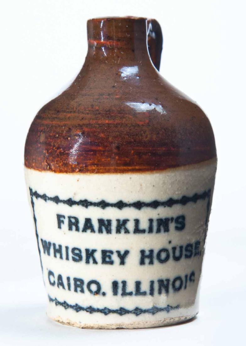 CAIRO, ILLINOIS MINIATURE ADVERTISING JUG: Bicolor glaze and stamped advertisement "FRANKLIN'S WHISKEY HOUSEâ€¦" 3" high.