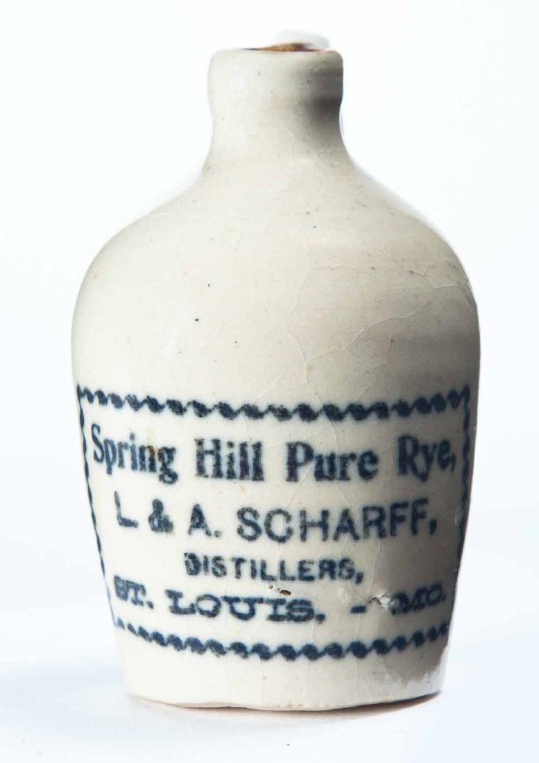 ST. LOUIS, MISSOURI MINIATURE ADVERTISING JUG: Cream glaze and stamped advertisement "Spring Hill Pure Rye, L. & A. SCHARFFâ€¦" 3" high.