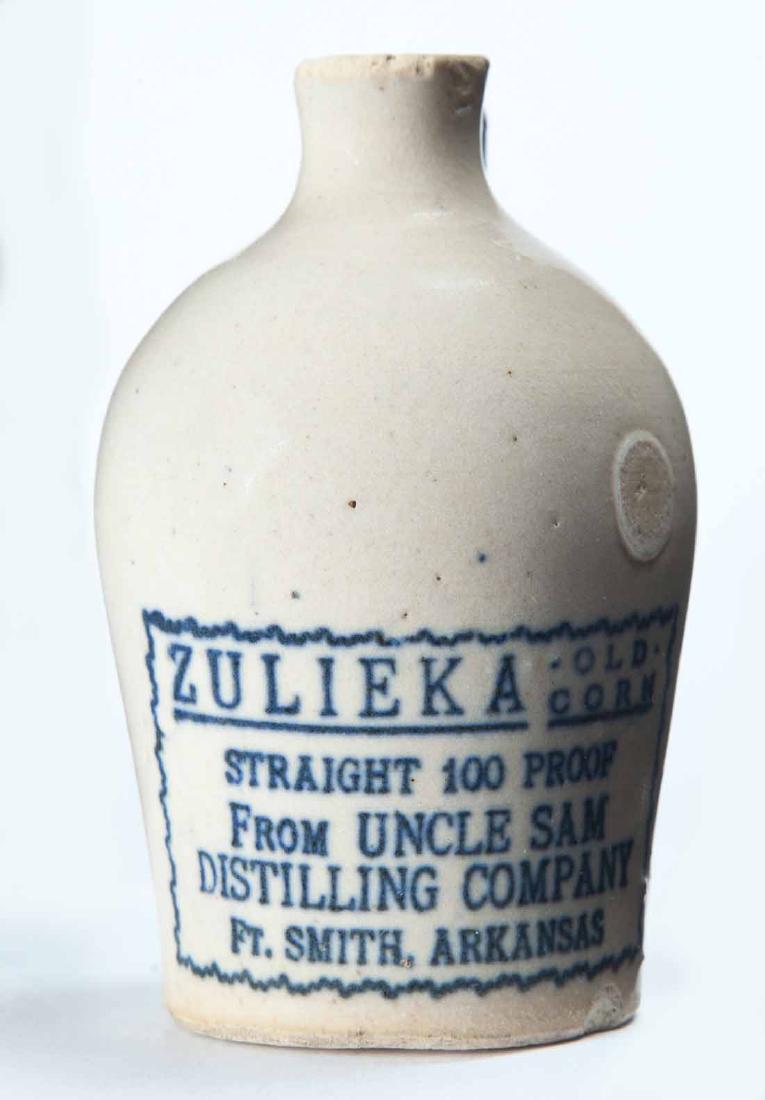 FORT SMITH, ARKANSAS MINIATURE ADVERTISING JUG: Cream glaze and stamped advertisement "ZULIEKA OLD CORN STRAIGHT 100 PROOFâ€¦" 3.25" high.