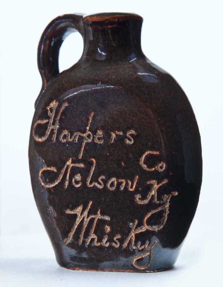 NEW YORK-KENTUCKY MINIATURE ADVERTISING JUG: Scratch-decorated double-sided advertisement "Harpersâ€¦" and "J.T. Calkins Ithaca, N.Y." 3" high.