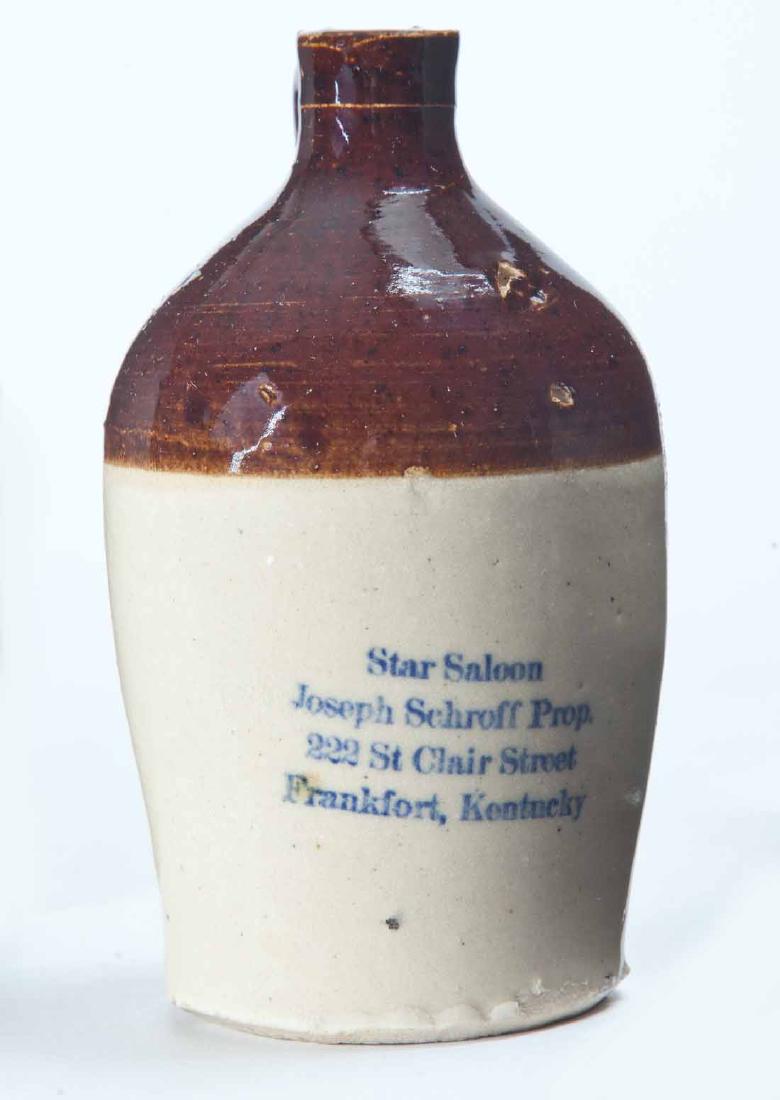 FRANKFORT, KENTUCKY MINIATURE ADVERTISING JUG: Bicolor glaze and stamped advertisement "Star Saloon Joseph Schroff Propâ€¦"' 4.5" high.