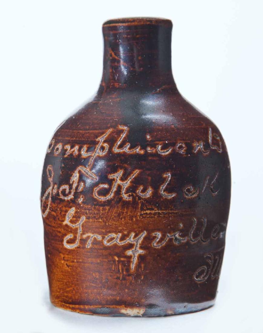 GRAYVILLE, ILLINOIS MINIATURE ADVERTISING JUG: Scratch-decorated advertisement "Compliments of J.F. Kulakâ€¦" 3.25" high.