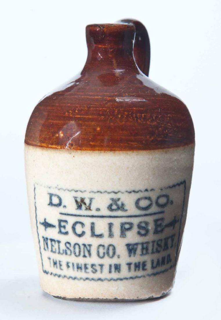 NELSON COUNTY, KENTUCKY MINIATURE ADVERTISING JUG: Bicolor glaze and stamped advertisement "D.W. & CO. ECLIPSEâ€¦" 3.25" high.