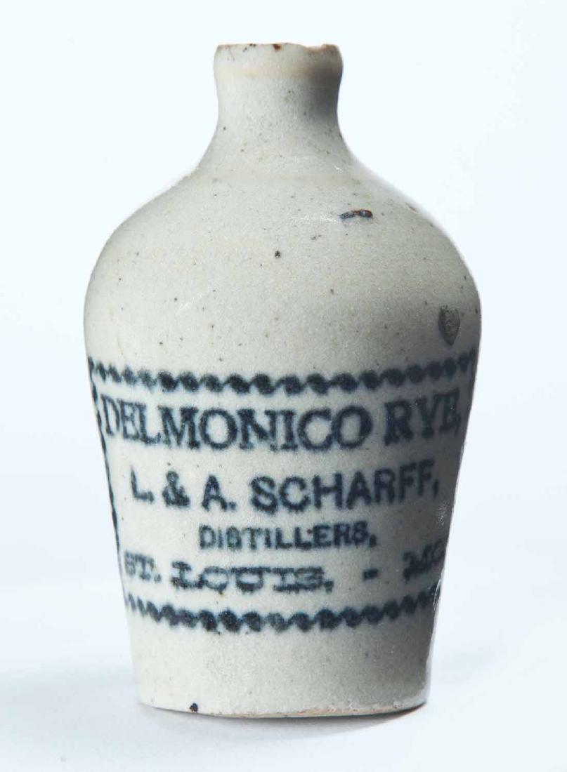 ST. LOUIS, MISSOURI MINIATURE ADVERTISING JUG: Cream glaze and stamped advertisement "DELMONICO RYE, L. & A. SCHARFFâ€¦" 3" high.