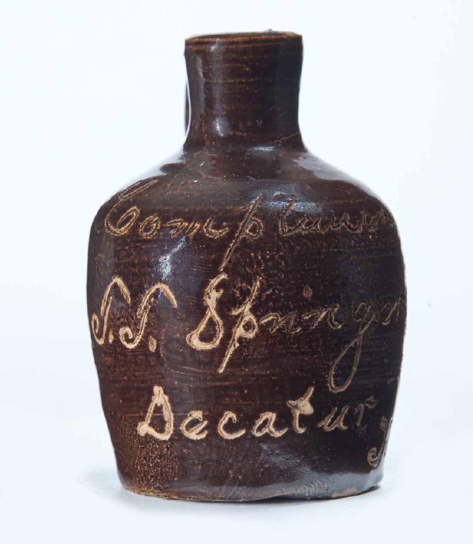 DECATUR, ILLINOIS MINIATURE ADVERTISING JUG: Scratch-decorated advertisement "Compliments of T.T. Springerâ€¦" 3" high.
