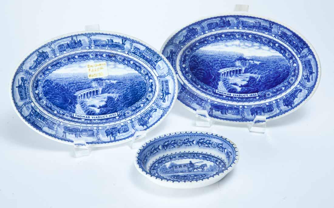 3 SCAMMELL'S LAMBERTON BALTIMORE & OHIO CENTENARY OVAL: Marked, blue and white transfer-print first produced for the 1927 Centenary. 2 small oval dishes with the Thomas Viaduct, 8" long; and a small, oval, deep dish with the Horse-Drawn Car, 5" long.