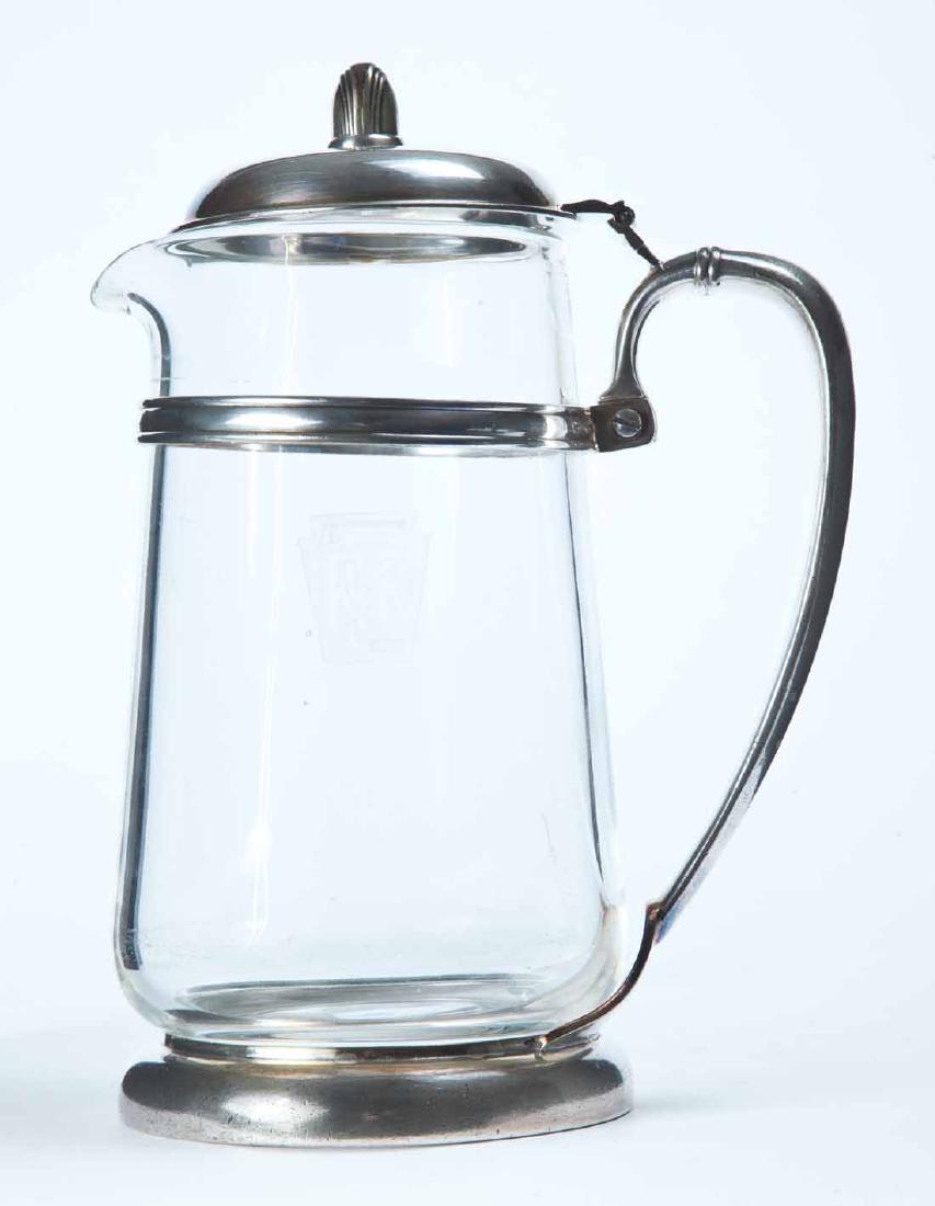 PENNSYLVANIA RAILROAD WATER PITCHER: Clear glass with keystone and "PRR" etched on front in silver plate holder by "International Silver". 10"h.