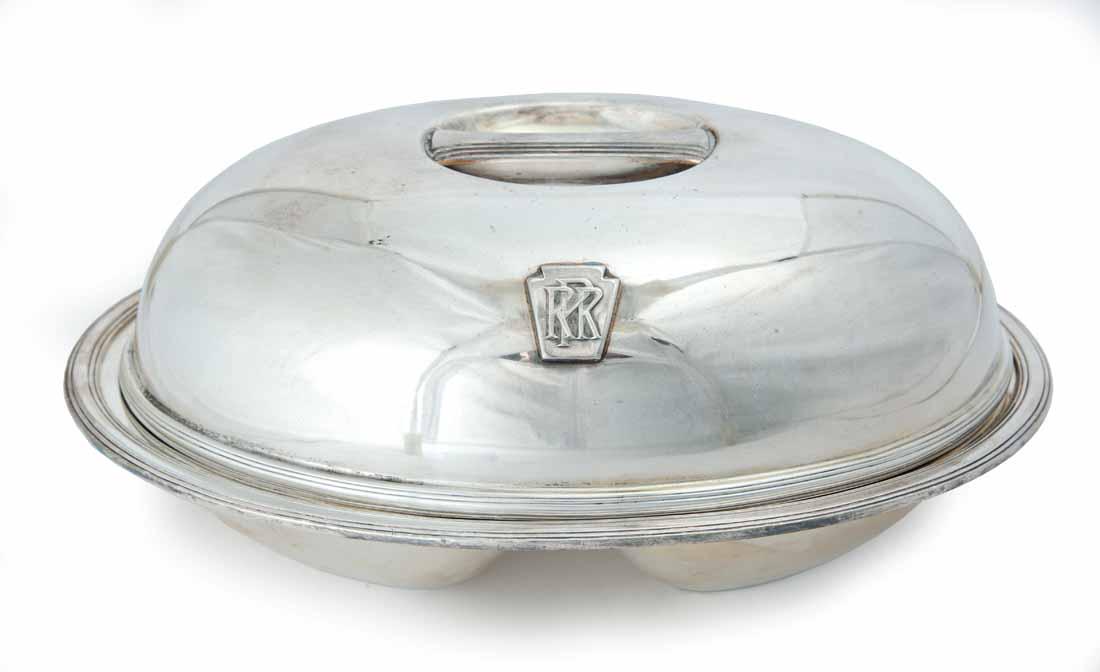 PENNSYLVANIA RAILROAD SILVERPLATE SERVING DISH: Divided dish with cover. Both pieces with keystone and "PRR". Made by "International Silver". 4.75"h. 11"w.