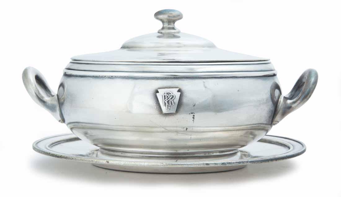 PENNSYLVANIA RAILROAD SILVERPLATE SAUCE TUREEN: Keystone and "PRR" on front of tureen. Tureen comes with lid and undertray. Tureen made by "Rowley Mfg", tray made by "CMCo". 5"h. 7"w.