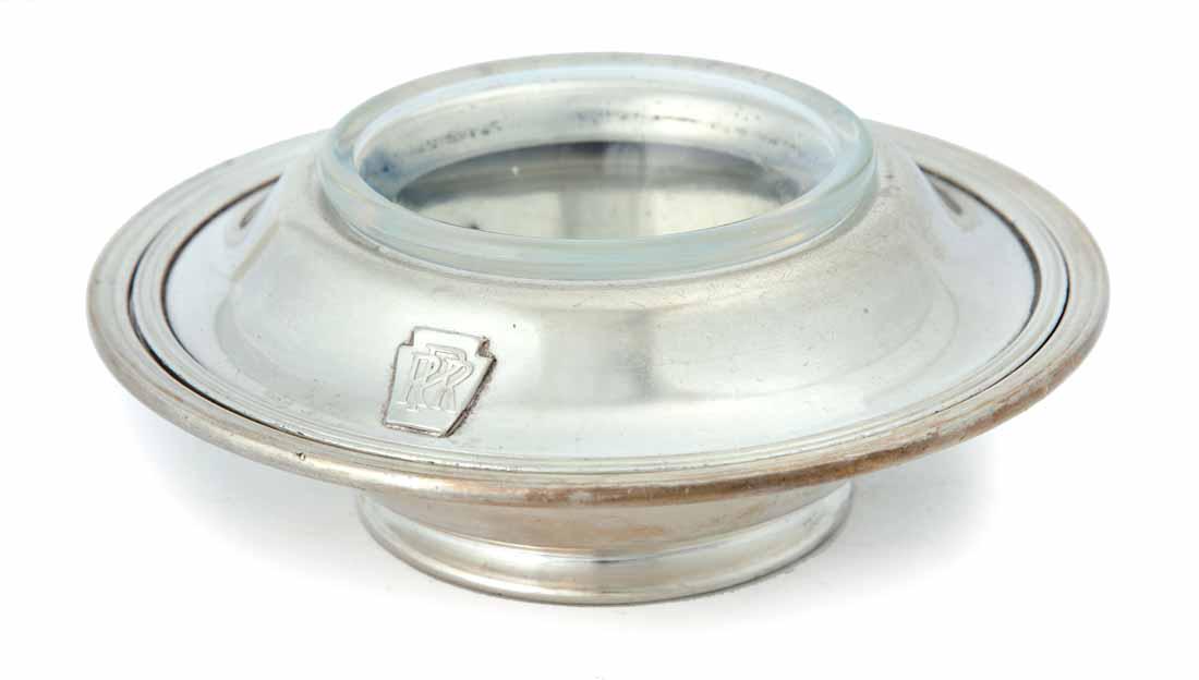 PENNSYLVANIA RAILROAD SILVERPLATE CONDIMENT DISH: Three piece with base, bowl holder and glass bowl. Keystone and "PRR" on rim. Made by "International Silver". 2.75"h. 6.5"dia.
