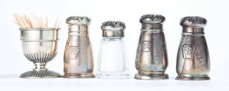 FIVE PENNSYLVANIA RAILROAD DINING CAR ITEMS: Group consists of four salt and or pepper shakers, three silverplate with keystone and "PRR", one glass with silverplate cap with keystone and "PRR". Made by "International Silver". 3"h. Toothpick wit