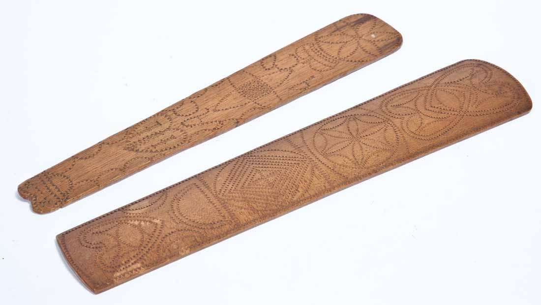 2 SAILOR-MADE BUSKS: American or English, 19th century, beech and oak. Each elaborately chip-carved. 12.5" and 13" long.