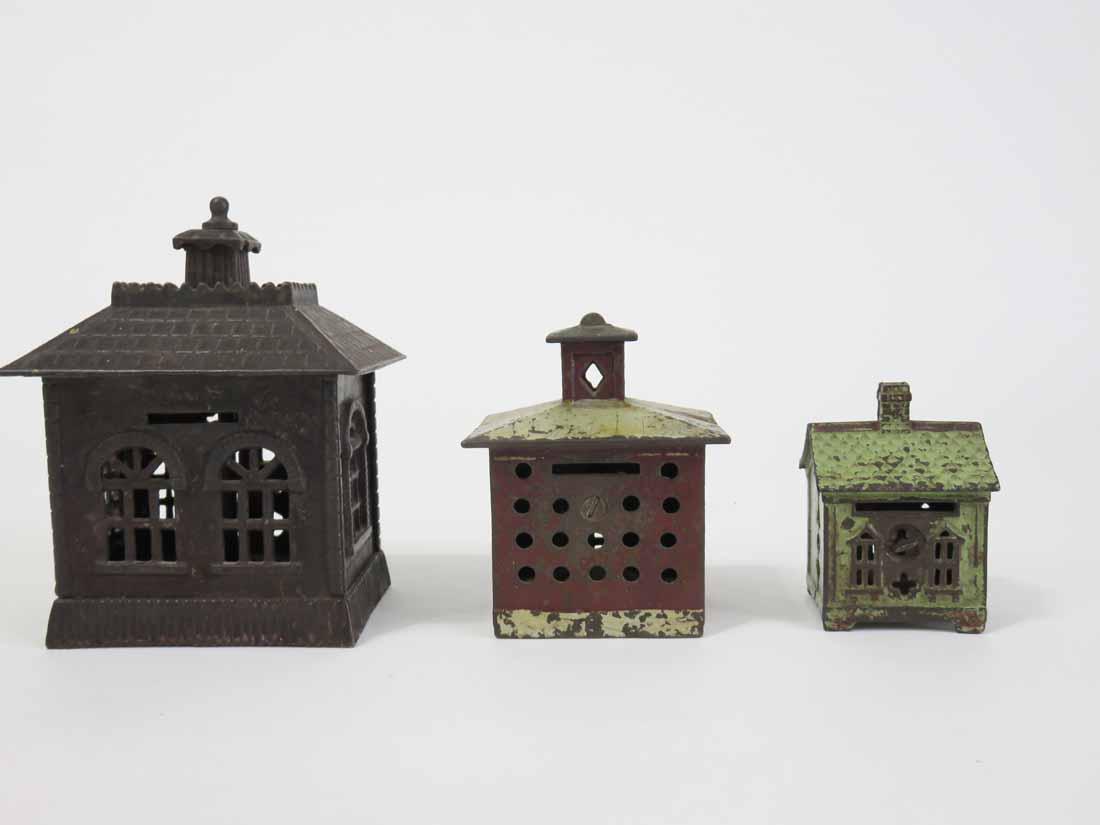 THREE CAST IRON BUILDING BANKS (1 of 5)