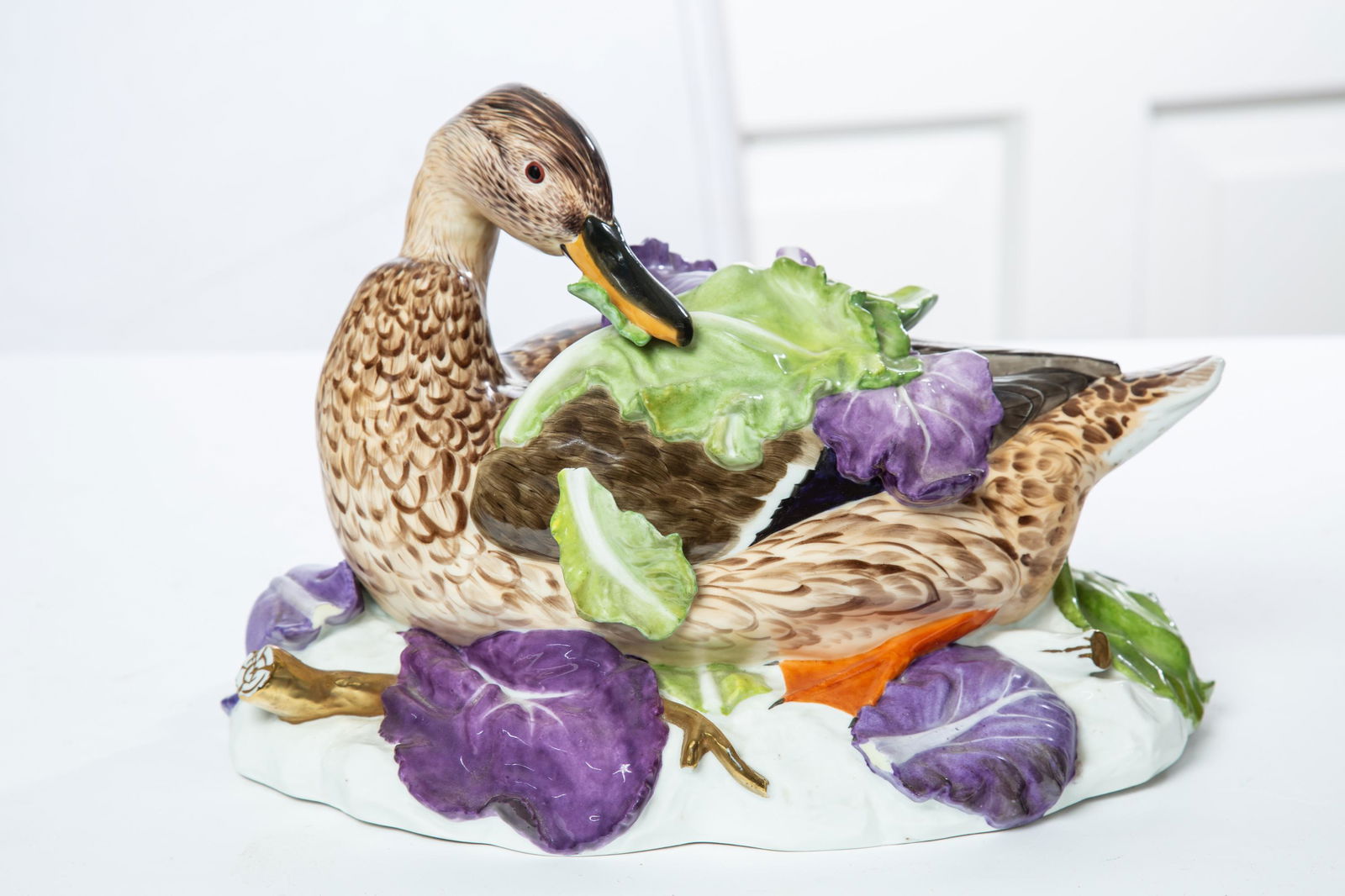 PORCELAIN DUCK CENTERPIECE: German, late 19th century. Decorated with polychrome paint and gilt accents. Unmarked. 8.5" high, 12" wide, 7" deep. (DR9)
