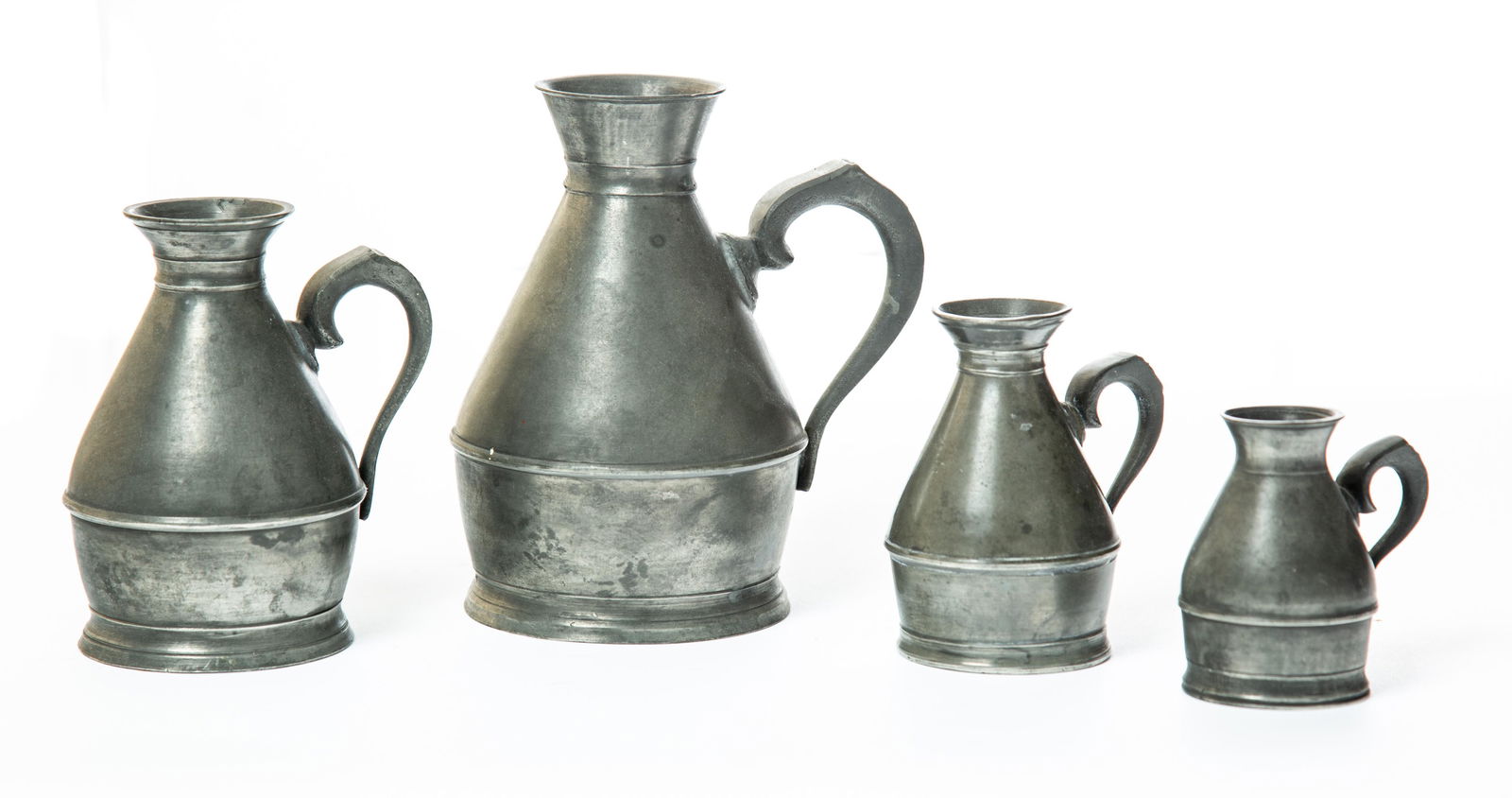 GRADUATED SET OF FOUR "HAYSTACK" PEWTER MEASURES (1 of 4)