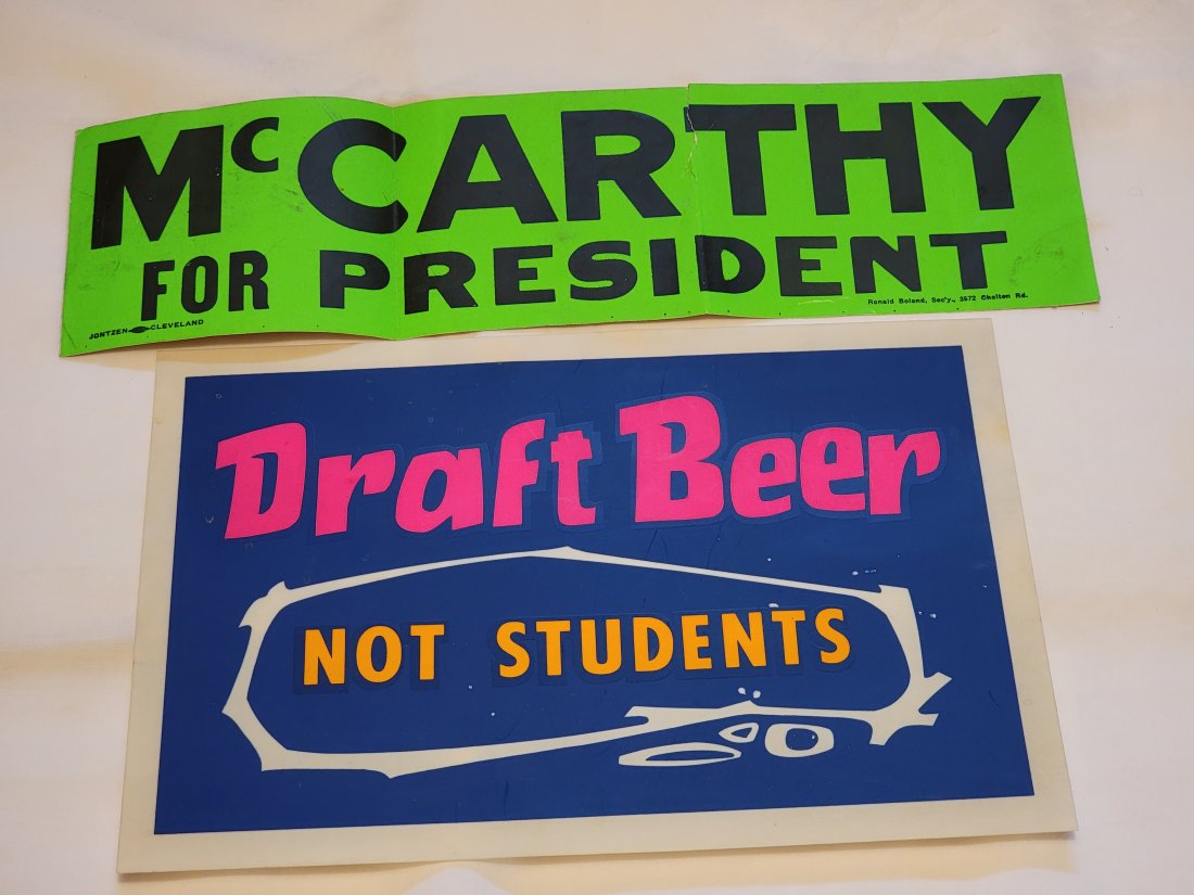 TWO PIECES OF 1960S-1970s EPHEMERA: Includes a McCarthy for President bumper sticker, and a thin plastic â€œDraft Beer Not Students” sign. 15” and 12” long, respectively.