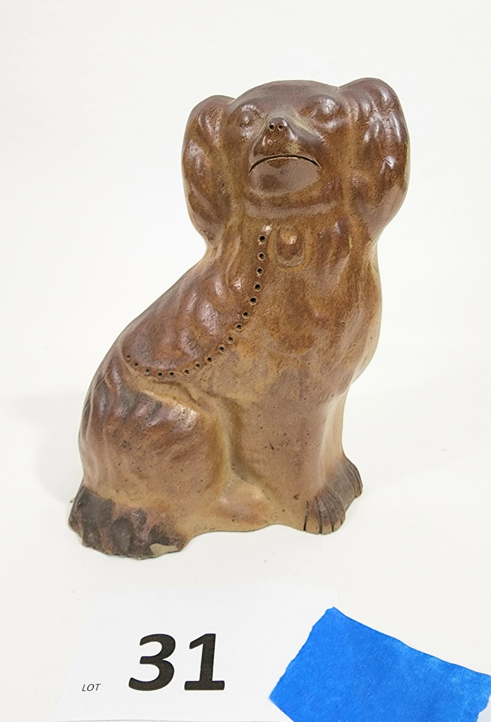 POTTERY DOG: Possibly Ohio, late 19th-early 20th century, earthenware. Seated spaniel wit a rust-colored glaze. 8" high.