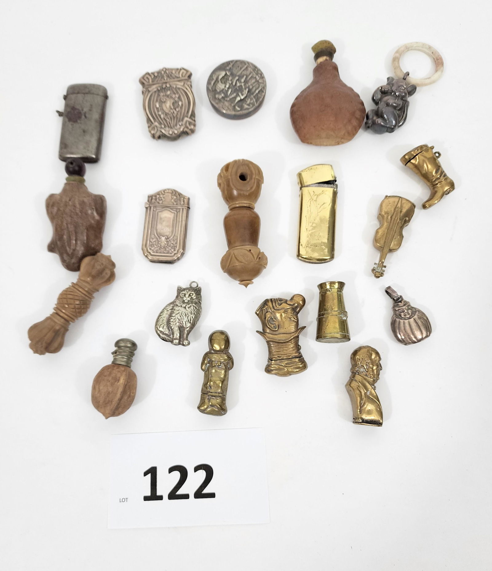 COLLECTION OF SNUFFS, MATCH SAFES, AND PILL BOXES: 19th-20th century. Includes brass, sterling, pottery, and carved tagua nut. 1.5" to 3.5" high.