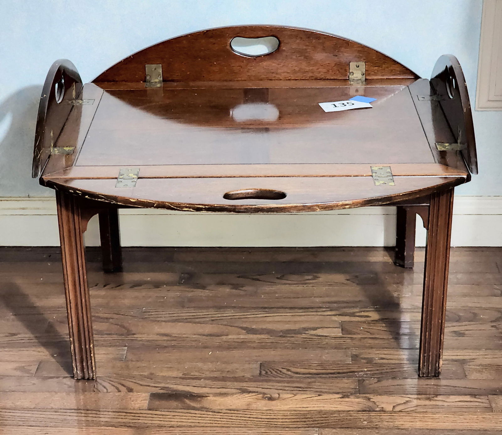 GEORGIAN-STYLE BUTLER'S TABLE: 20th century, mahogany. Molded legs and lift-off tray. 18" high, 43" long.